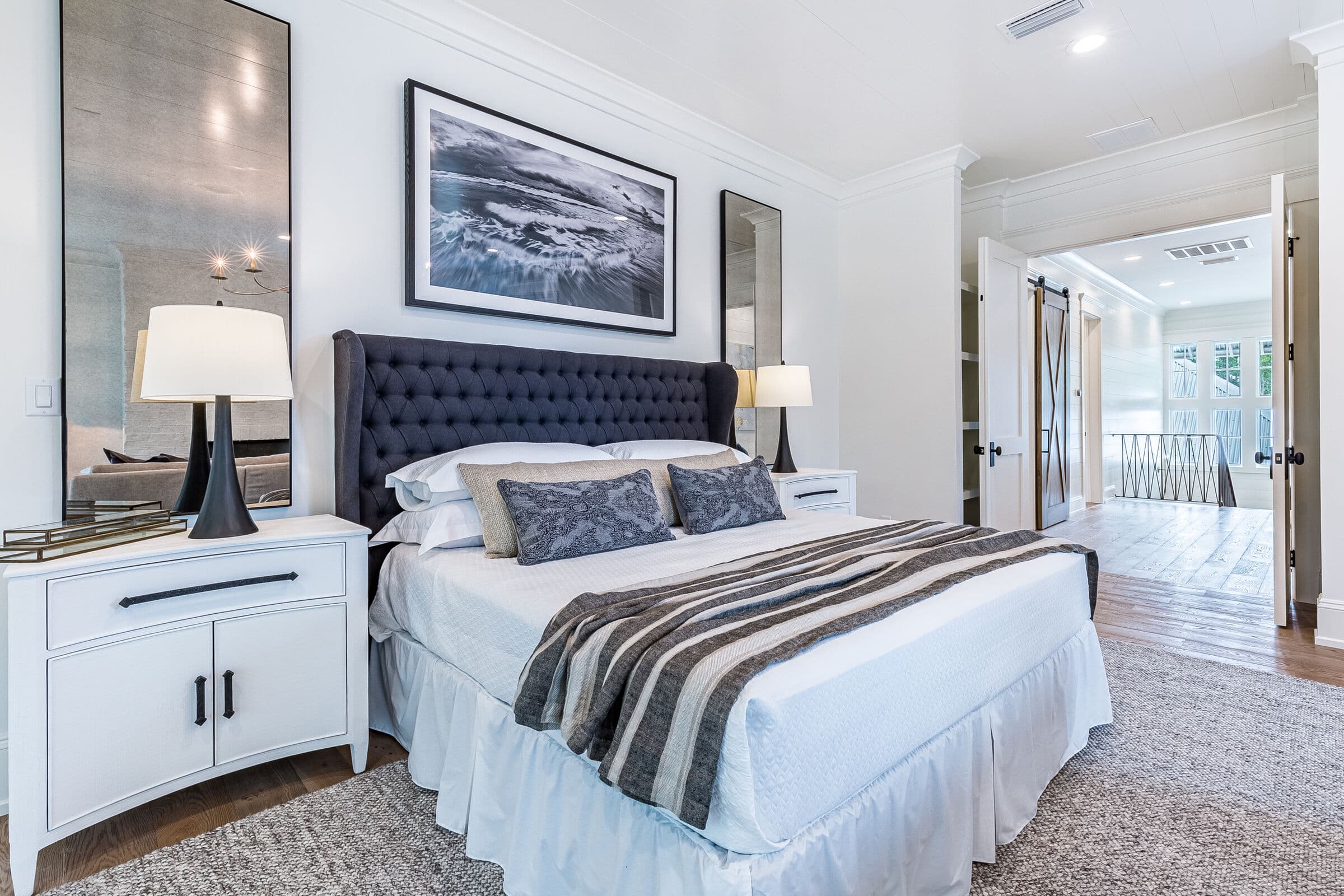 Made-up main bedroom with French doors