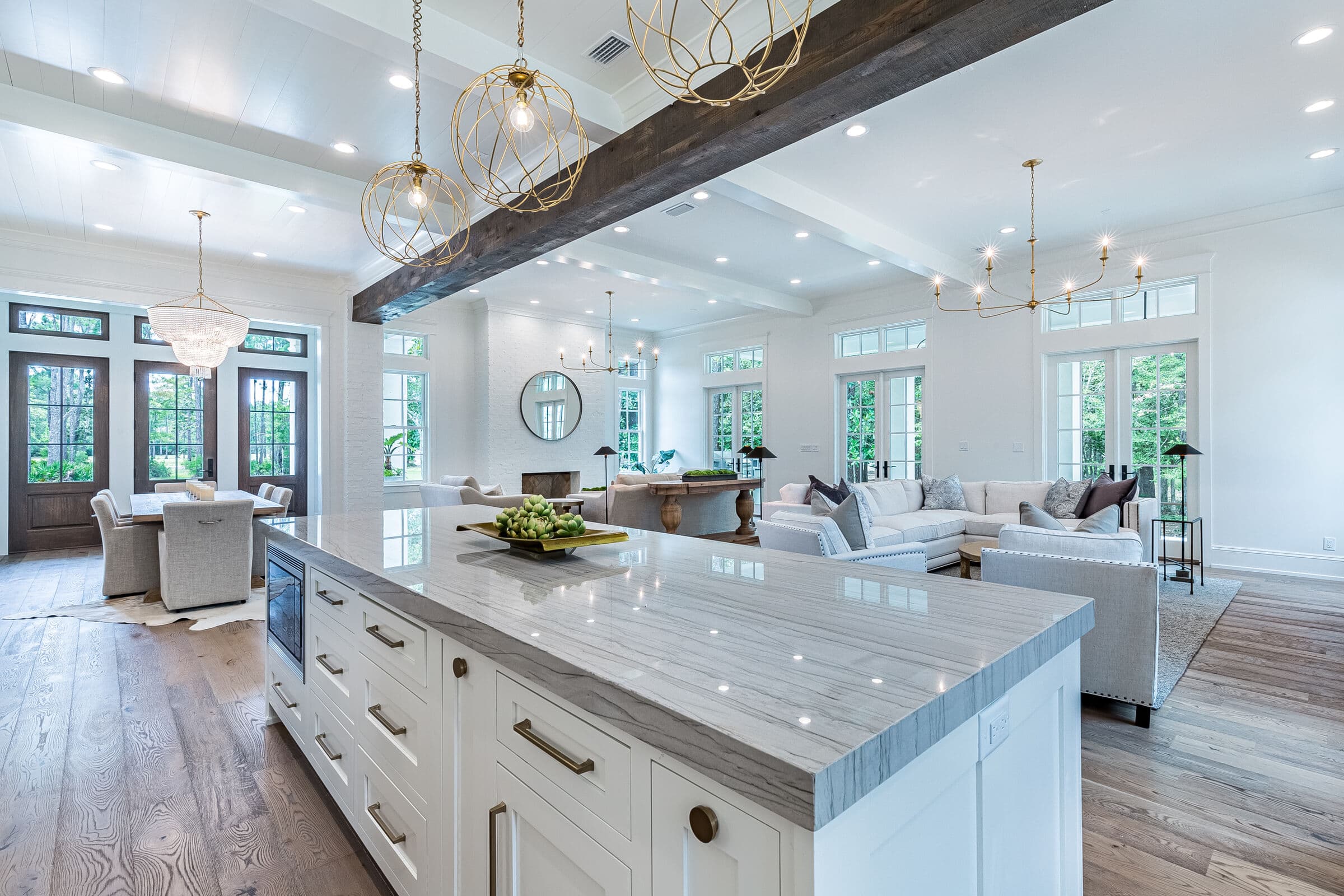 Bright white kitchen with an island and pendant lights
